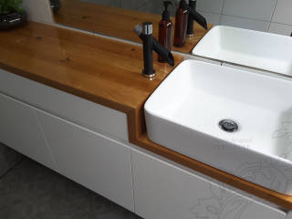 Timber bathroom vanity with clothes hanging up