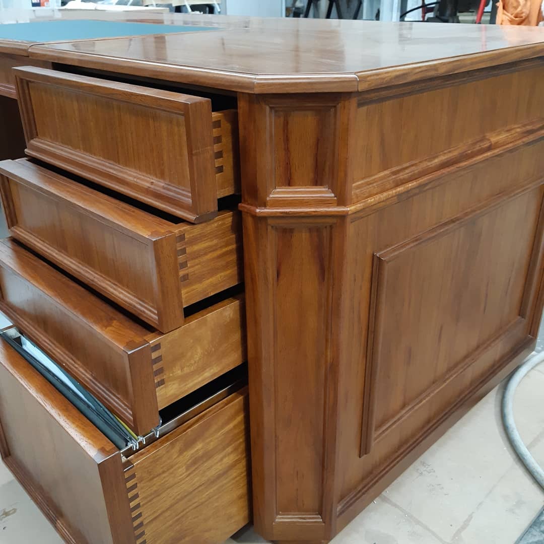 Luxurious timber desk with draws pulled out