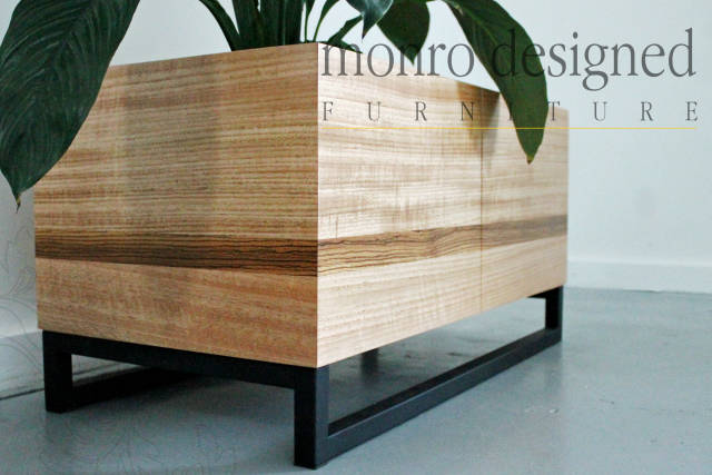 Timber planter with plant